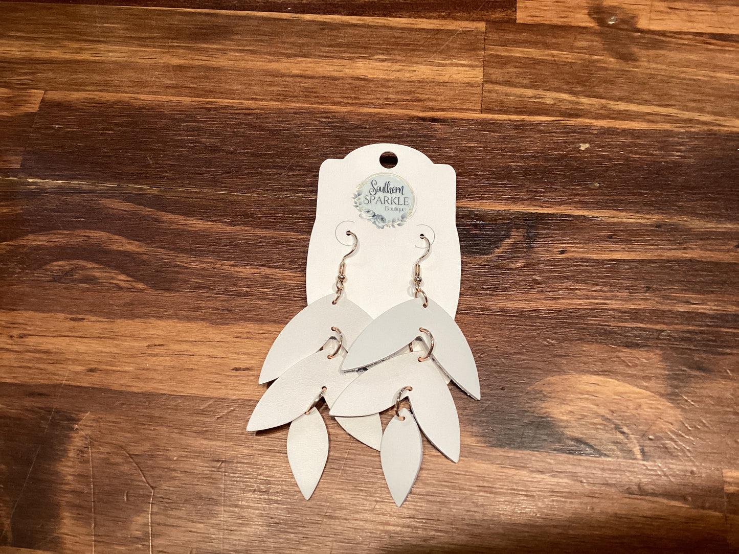 SSB white V dangle earrings